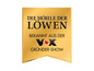 Goldenes Label mit dem Text 'Die Höhle der Löwen' und dem Logo des deutschen Fernsehsenders VOX.