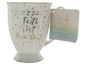 Eine weiße Disney Tinkerbell Tasse mit goldenen Sternen und dem Text 'All it takes is Faith, Trust & Pixie Dust'.