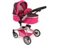 Ein rosa Kinderwagen mit weißen Punkten für Puppen.