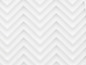 Eine weiße Textur mit einem Zickzackmuster.
