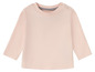 Ein rosa Langarmshirt für Babys.