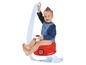 Ein Kind auf einem roten Baby-Potty Töpfchen mit einer Rolle Toilettenpapier.