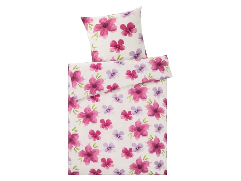 Ein weißer Bettbezug mit rosafarbenen Blumenmuster.