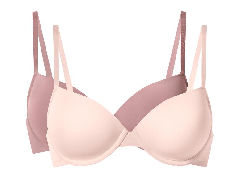 Zwei BHs in Rosa und Beige.