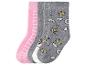 Vier Paar Kindersocken, zwei rosa und zwei graue mit Einhorn- und Kronenmustern.