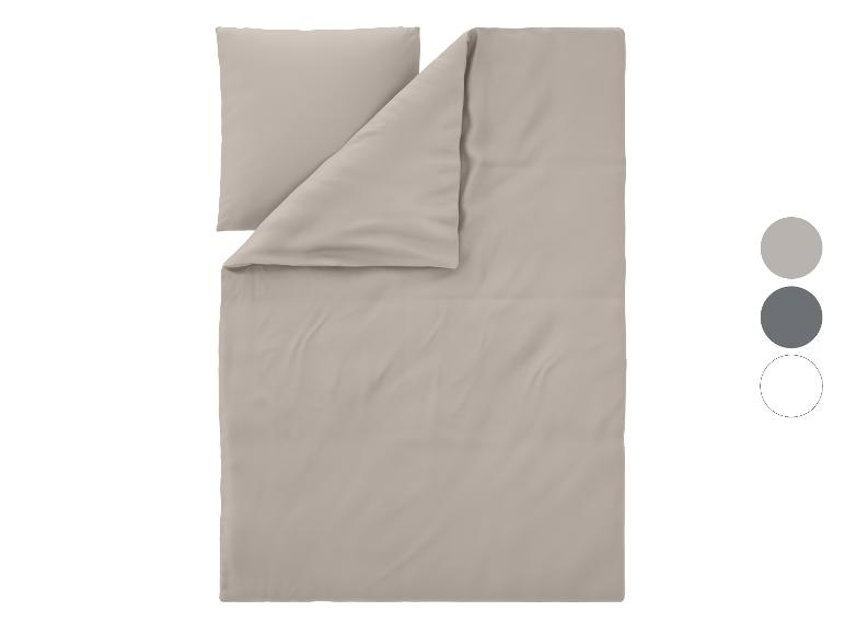 Einfarbiges beiges Bettwäsche-Set mit Kissen und Bettbezug, mit Farbmustern.