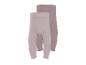 Zwei gerippte Baby-Leggings in Hellrosa und Beige.