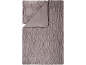 Graue Decke mit geraffter Textur und umgeschlagener Ecke.