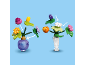 Zwei bunte Spielzeugblumensträuße mit austauschbaren Blüten und Vasen.