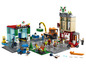 LEGO City Set mit einer Tankstelle, einer Pizzeria und verschiedenen Fahrzeugen.