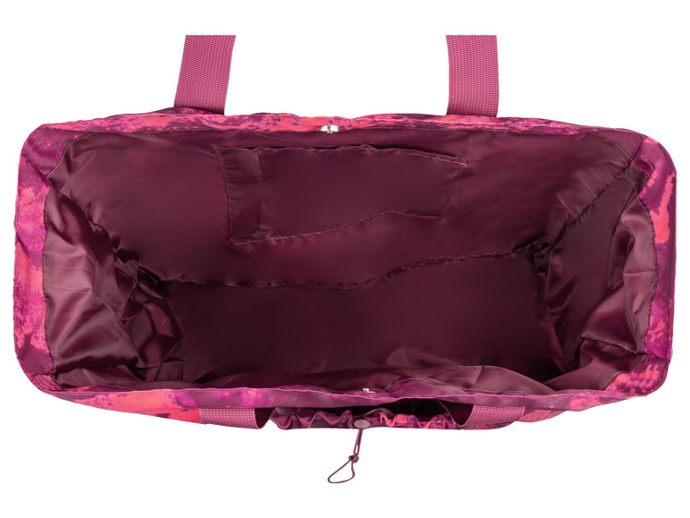 Eine rosa Tasche mit Muster, von innen betrachtet.