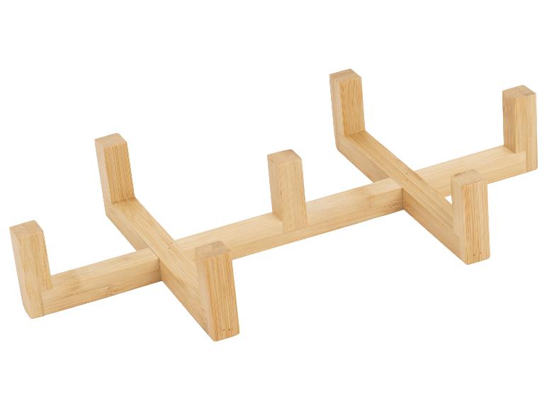 Holzständer für Teller oder Deckel, aus hellem Bambusholz gefertigt.