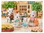 SYLVANIAN FAMILIES Sammelfigur Familie: Vier Katzenfiguren sitzen an einem Café-Tisch im Freien.