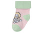 Rosa Baby-Socken mit einem Hasenmotiv.