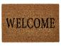 Eine Willkommensmatte mit der Aufschrift 'WELCOME'.