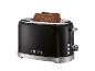 Schwarzer Toaster mit zwei Scheiben Vollkornbrot, mit der Aufschrift „1973“.