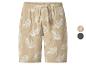 Beige Leinen-Shorts mit weißem Blättermuster und verstellbarem Kordelzug.
