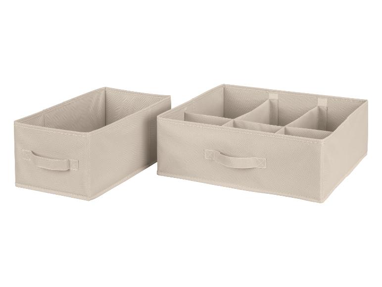 Zwei beige Aufbewahrungsboxen, eine mit Fächern.