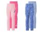 Set aus vier Kinderleggings: zwei rosa mit Alien-Motiv und zwei blaue mit Prinzessinnen-Motiv.