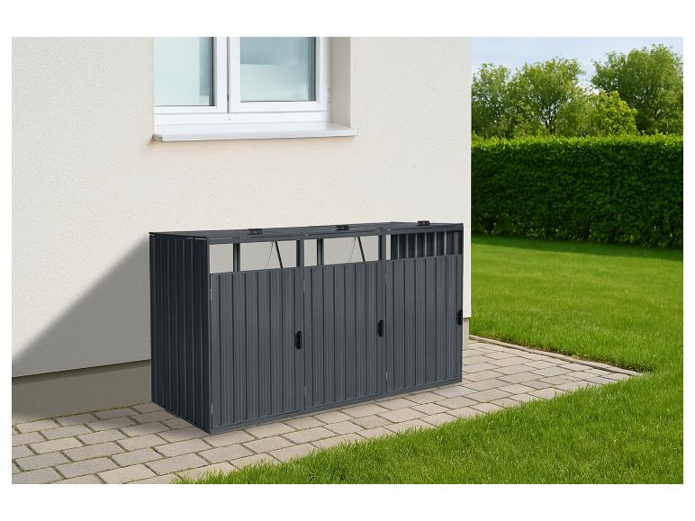 Dunkelgraue Mülltonnenbox mit drei Fächern an einer Hauswand und Rasenfläche.