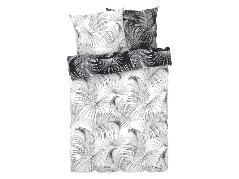 Ein weißer Bettbezug mit schwarzen Palmenblättern.