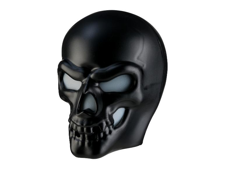 Schwarze Totenkopfmaske mit leuchtenden Augen und Nase.