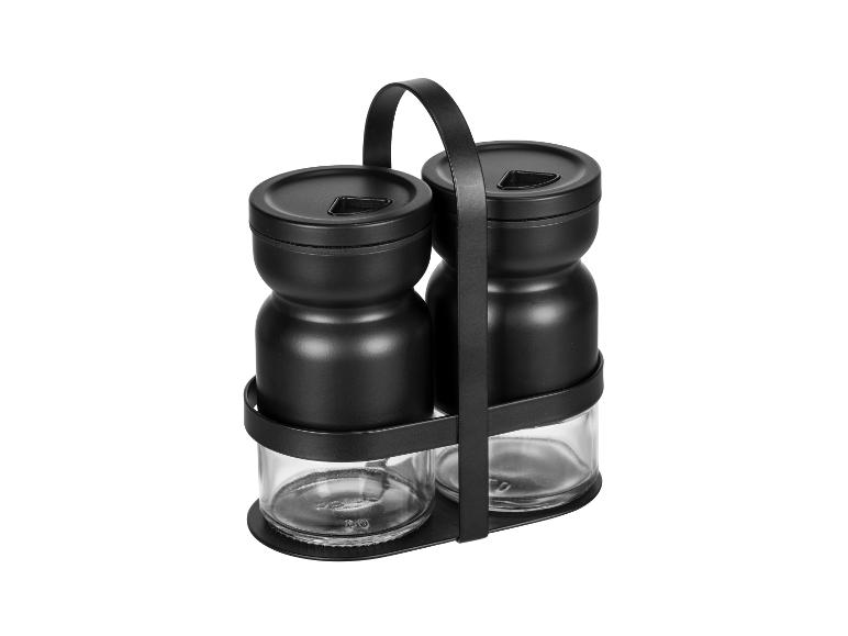 Zwei schwarze Gewürzbehälter mit Halter.