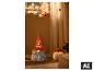 Leuchtender LED-Halloween-Wichtel mit orangefarbenem Hut und grauem Bart. [KI-generiertes Bild]