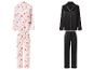 Zwei Pyjama-Sets: eines weiß mit roten Herzen und eines schwarz mit weißer Paspelierung.