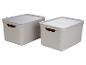 Zwei weiße Aufbewahrungsboxen mit Deckeln.