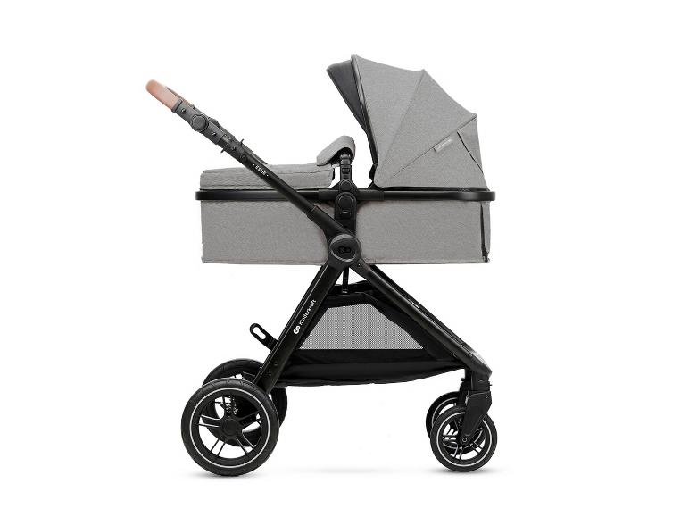 Grauer Kinderwagen mit Babywanne und braunem Griff, Seitenansicht.