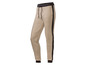 Beige Jogginghose mit schwarzem Streifen.