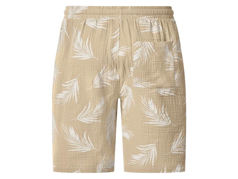 Beige Leinen-Shorts mit weißem Palmenblattmuster und elastischem Bund