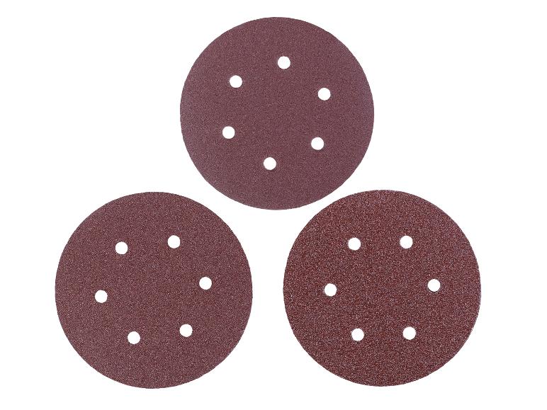 Drei runde Schleifscheiben mit Löchern für Schleifmaschinen.