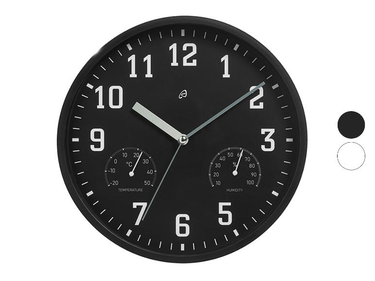 Schwarze Wanduhr mit Thermometer und Hygrometer.