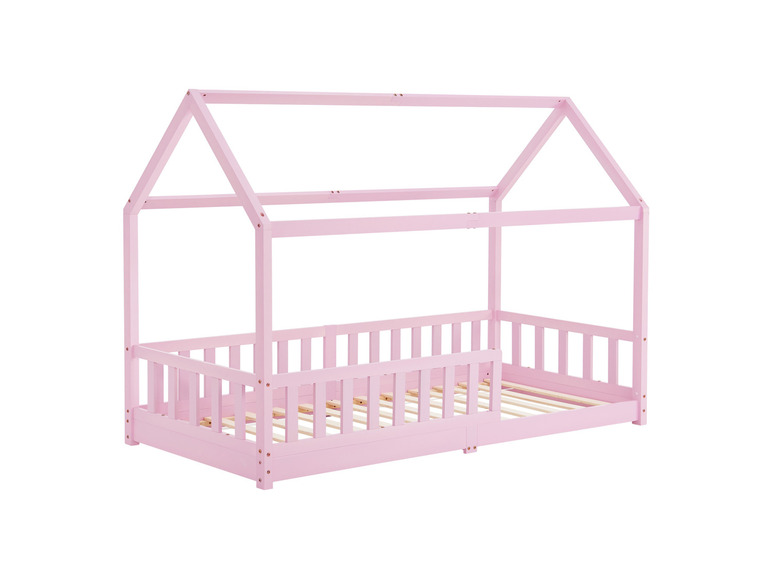 Ein rosa Kinderbett aus Holz mit Hausdach.