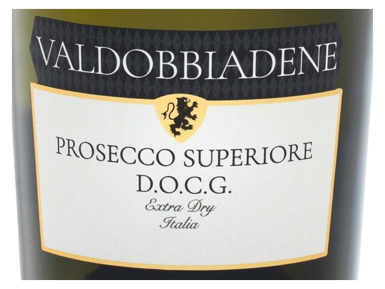 Sektetikett mit dem Text „VALDOBBIADENE PROSECCO SUPERIORE D.O.C.G. Extra Dry Italia“ und einem Löwen.