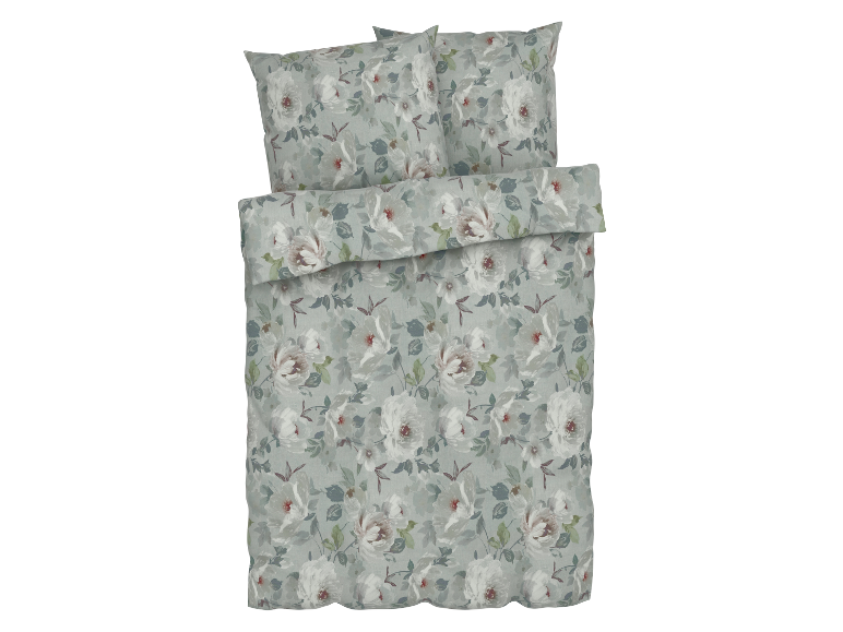Bettenwäsche mit Blumenmuster in Grün- und Weißtönen.