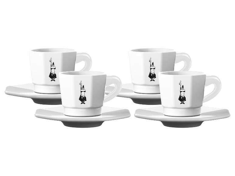 Set aus vier weißen Espressotassen mit Untertassen, verziert mit einer schwarzen Figur.