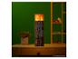 Minecraft Torch Tischlampe von The Noble Collection auf einem Schreibtisch aus Holz.