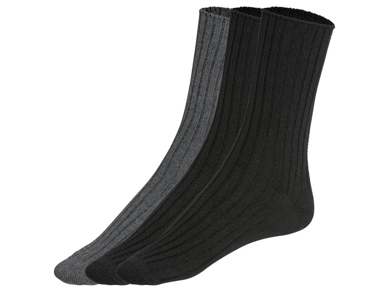 Drei Paar gerippte Socken in Schwarz und Grau.