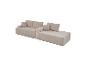 Beiges Cord-Modulsofa mit Kissen, das eine Chaiselongue-Konfiguration bildet.