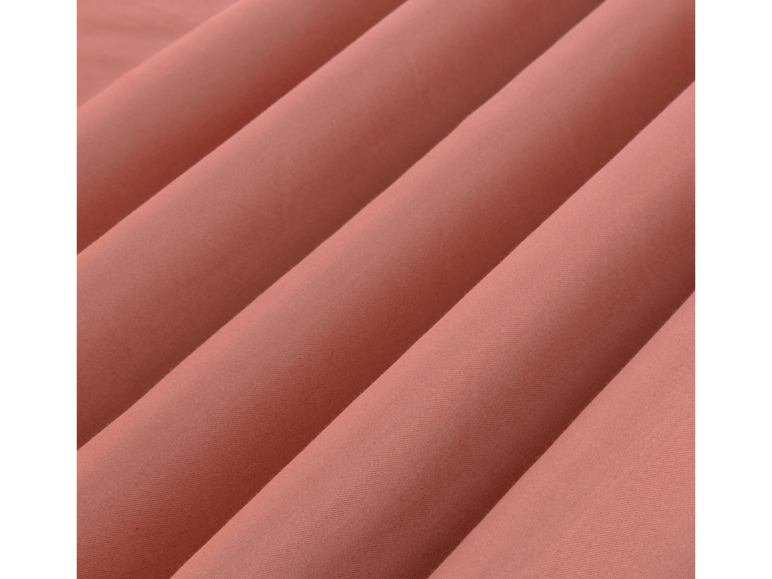 Nahaufnahme eines rosafarbenen Stoffes mit Textur.