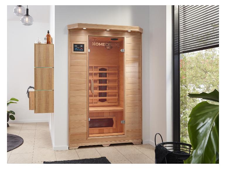 HOME DELUXE Infrarotsauna in einem modernen Badezimmer mit Holzschränken und Pflanzen.