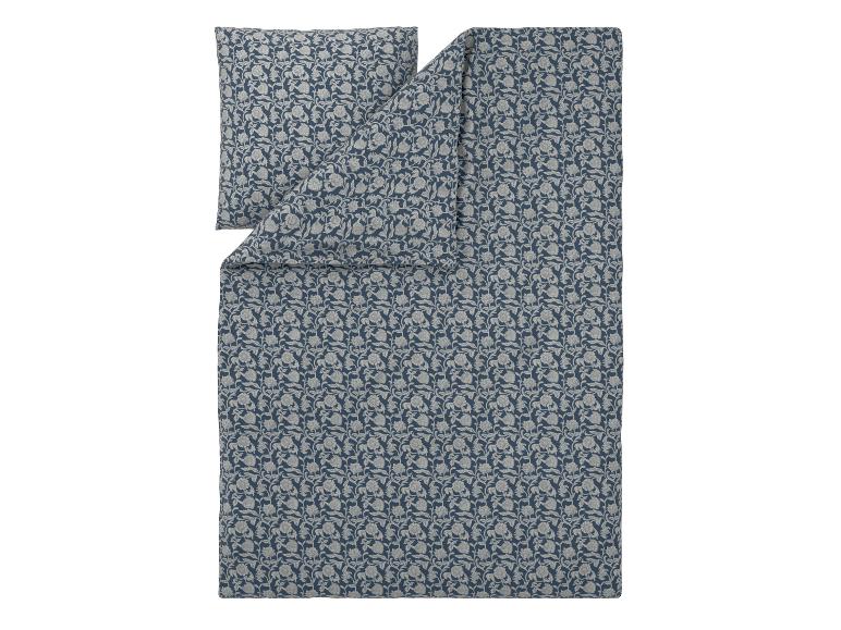 Bettwäsche-Set mit Blumenmuster in Blau- und Grautönen.