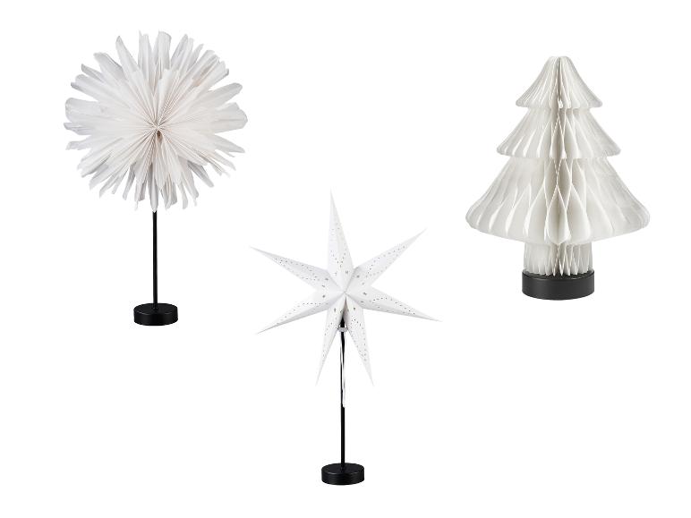 Weiße Papier-Weihnachtsdekorationen, darunter ein Stern, ein Baum und eine Kugel