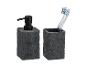 Dunkelgrauer Seifenspender und Zahnbürstenhalter aus Stein.