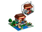 Lego Minecraft Set mit einem Haus, einem Teich und Figuren.