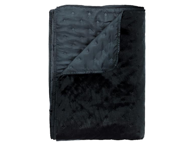 Gefaltete schwarze Samt-Steppdecke