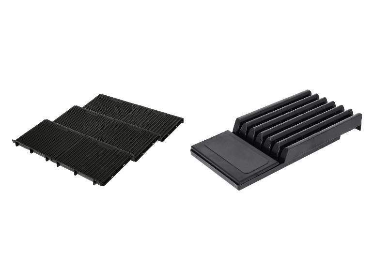 Schwarze Grillroste und schwarzer Messerorganizer.